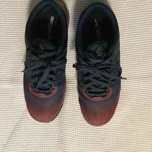 Steel toe shoes. Red & blue in color . Size 10W